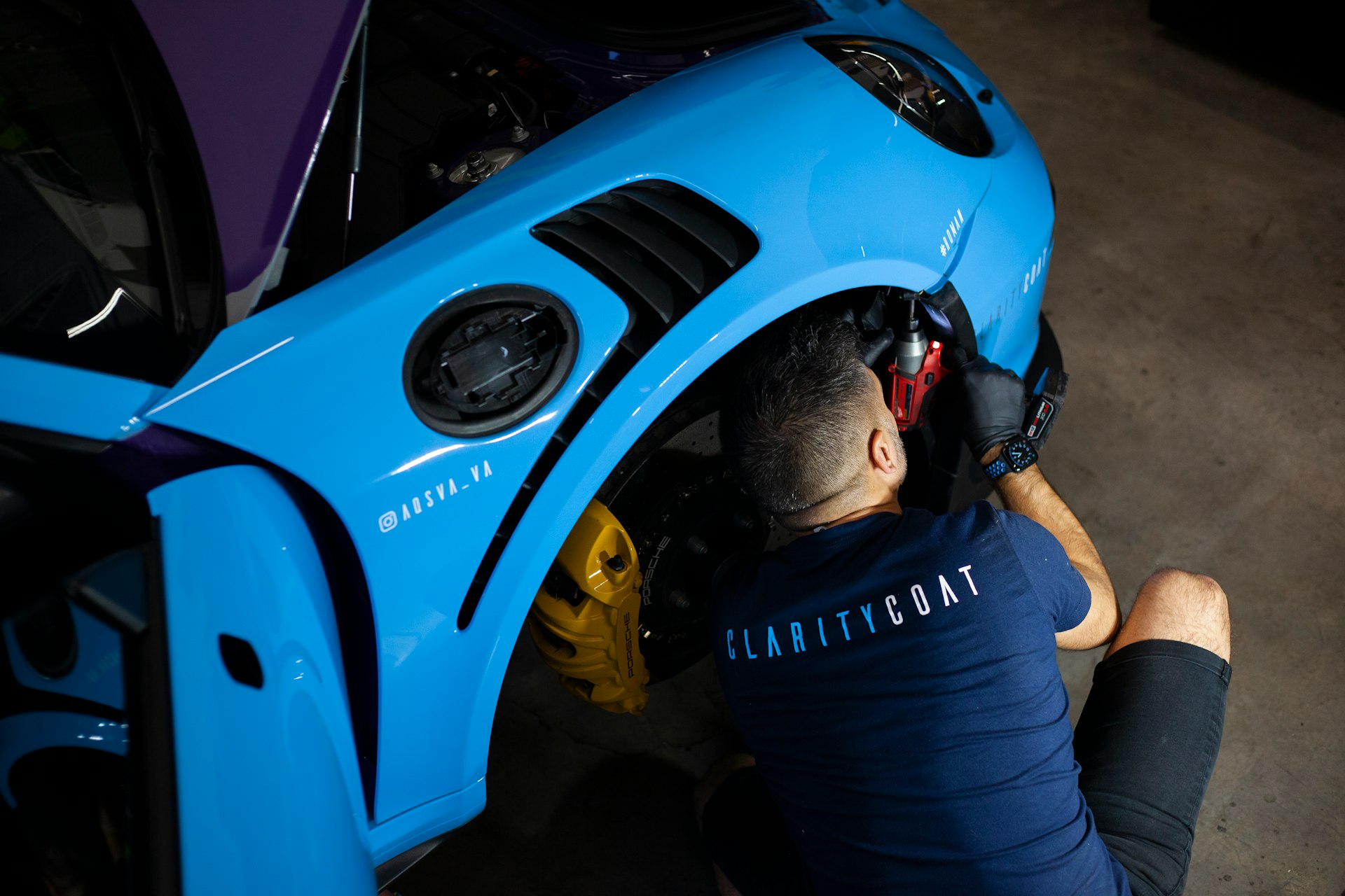 a man working on a car under the hood